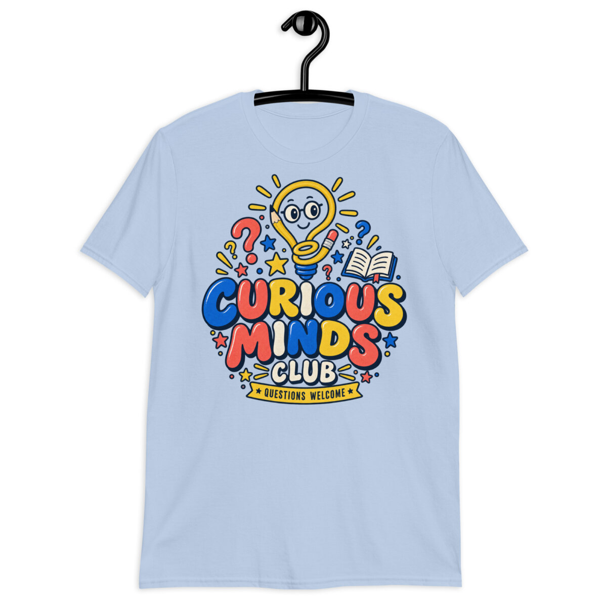Male teacher wearing a white Curious Minds Club Teacher T-Shirt in an elementary classroom