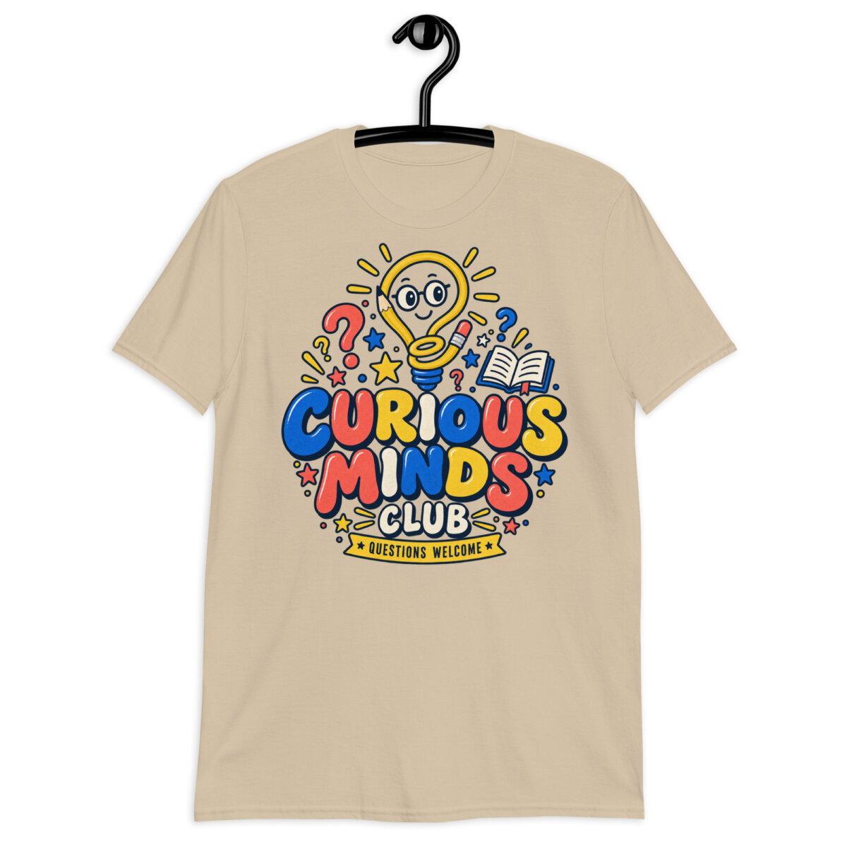 Male teacher wearing a white Curious Minds Club Teacher T-Shirt in an elementary classroom