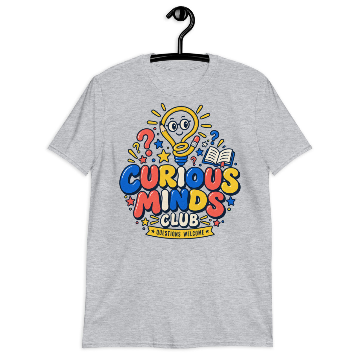 Male teacher wearing a white Curious Minds Club Teacher T-Shirt in an elementary classroom