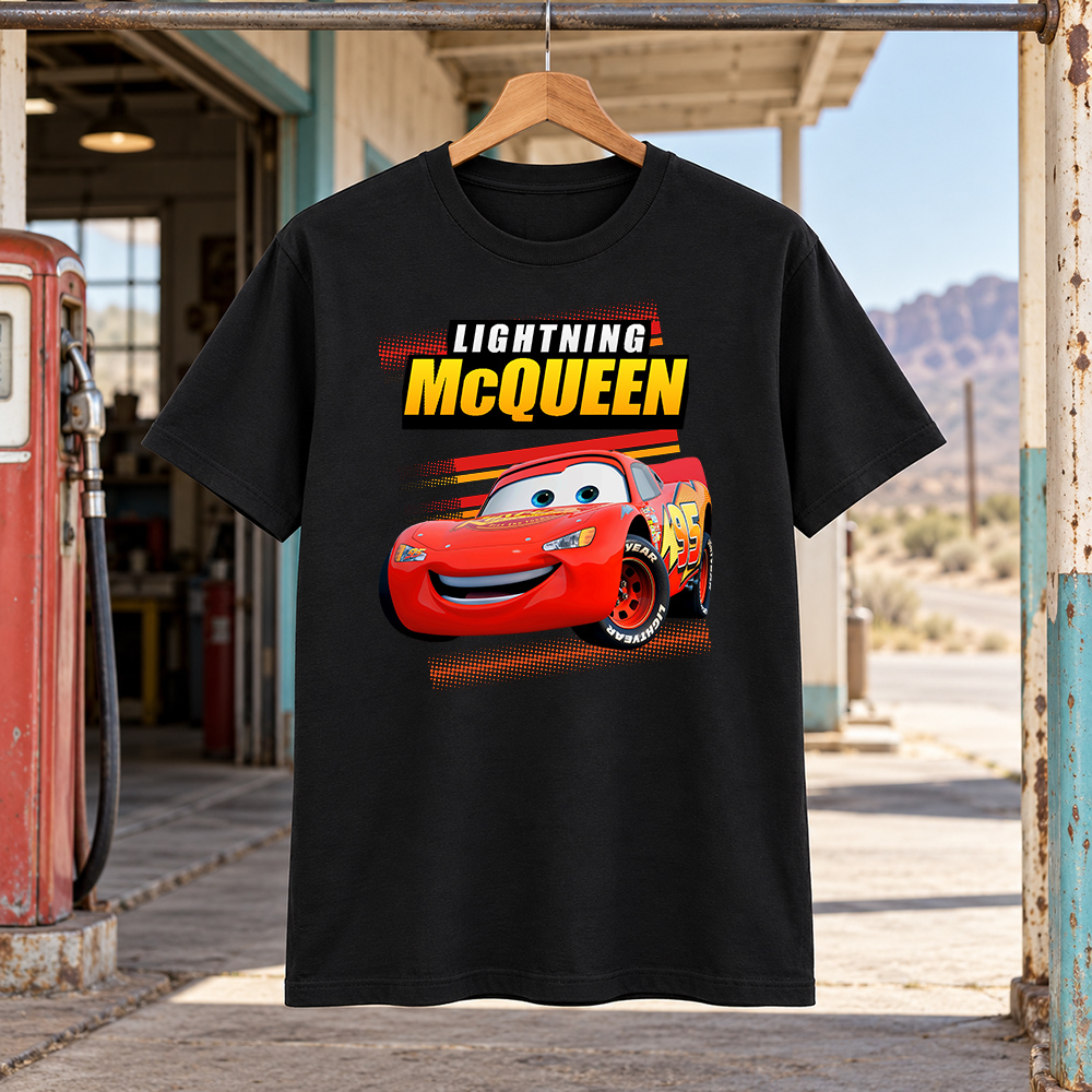 Black Lightning McQueen Shirt featuring the red Cars racer, yellow McQueen lettering, racing stripes, and halftone details.