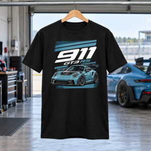 Black Porsche 911 Shirt with a blue GT3 RS car graphic and white 911 lettering, displayed in a racing garage.