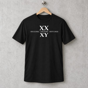 XX XY Shirt, Original Factory Settings white print on a black T-shirt hanging on a wooden hanger against a concrete wall