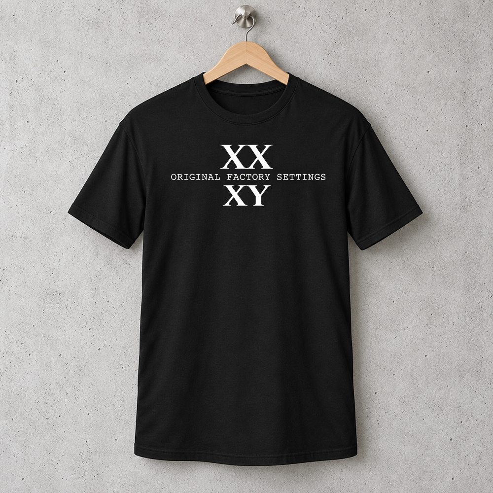 XX XY Shirt XX XY Shirt, Original Factory Settings white print on a black T-shirt hanging on a wooden hanger against a concrete wall